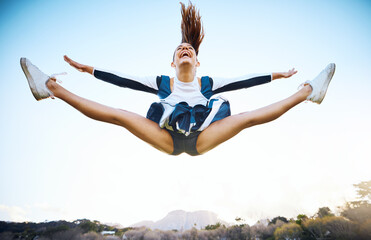 Cheerleader woman, sky and sports performance with smile and energy to celebrate outdoor....