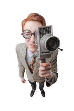 Funny silly guy shooting with a vintage video camera