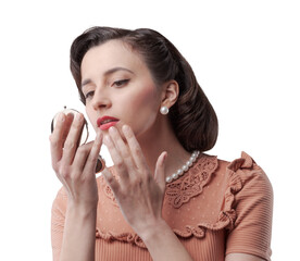 Elegant woman looking at herself in a mirror
