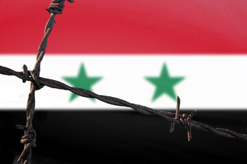 Syria flag behind barbed wire fence. Concept ща Civil War, dictatorship, discrimination and...