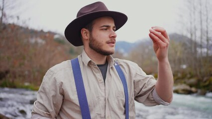 gold rush portrait pleased smiling of a gold digger test gold on a tooth bite,Finding gold