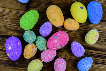 Fototapeta na wymiar Easter eggs made of styrofoam on a wooden background. Top view