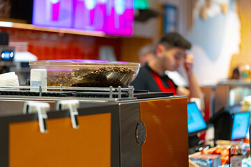 Coffee beans in a coffee machine in coffeeshop