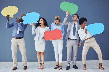 Speech bubble, team and comment by business people holding sign, news and voice icon feeling excited on social media. Group, opinion and poll by employees with mockup space in studio blue background - Powered by Adobe