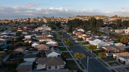 Sunset aerial view of dense suburban housing in Montebello, California, USA. - obrazy, fototapety, plakaty
