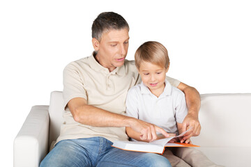 Father and Son Reading a Book on the Couch