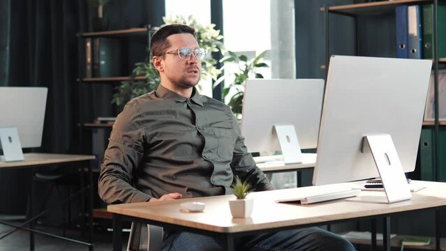 Angry stressed mad business man looking at laptop screen using pc having problem with computer in office, frustrated outraged worker annoyed with online failure, application error or system virus.