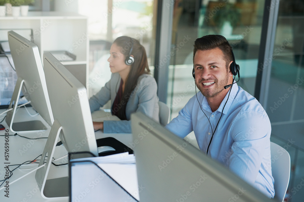 Aufkleber My customers can count on us to care. Portrait of a happy and confident young man working in a call center.