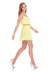 An aesthetic fashion female model from Canada dressed in a designer, trendy or stylish beautiful yellow outfit isolated on a png background