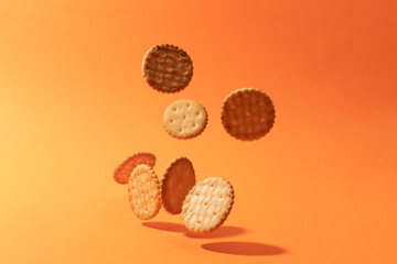 Cookies on orange background. Artistic background for pastry or sweet snacks