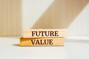 Wooden blocks with words 'FUTURE VALUE'. Business concept