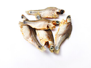 Dry puti mach or swamp barb or puntius fish or chola barb or puntius chola fish isolated on white background.Homemade sun dried fish.Dried fish is popularly known as shutki in indian subcontinent