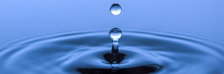 Fototapeta na wymiar single water drop falling down to surface
