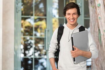 Fototapeta premium University young happy student posing in campus
