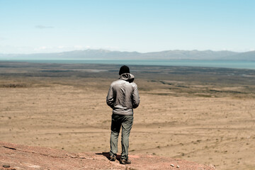 Man looking over vast Patagonian wilderness, El Chalten, Santa Cruz Province, Argentina