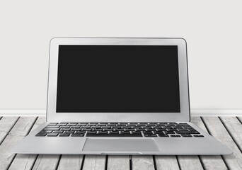 Fototapeta premium Moden laptop with a blank screen on the desk