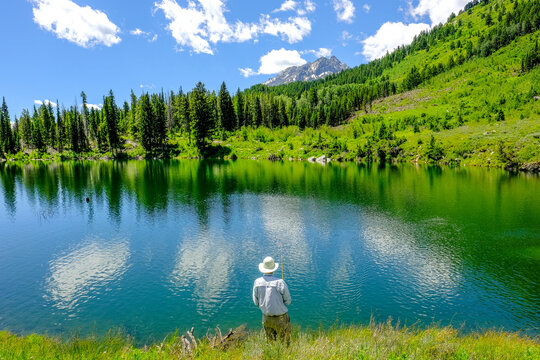 Person fishing in Trapper Lake, Wyoming, USA