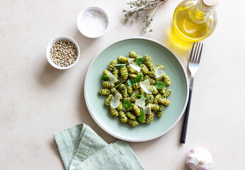 Gnocchi with pesto sauce, basil and Parmesan cheese. Healthy food. Vegetarian food. Diet.