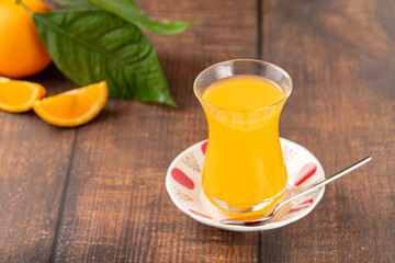 Winter drink orange oralet or oralette in a thin-waisted glass tea glass