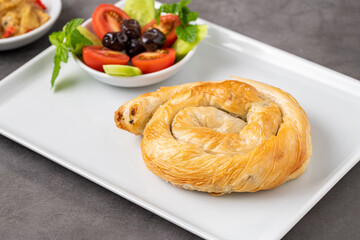 Traditional Turkish pastry made with spinach and cheese wrapped in phyllo. Turkish name gul boregi or gul borek