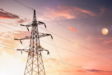 high voltage power lines in sunlight sunset light