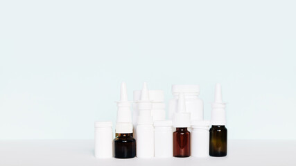 Set of different white and brown medicine bottles, pill bottles without label design, copy space on blue background	