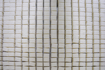 Top view of cube pressing line at sugar refinery.