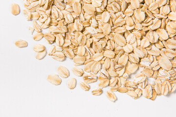 Oat flakes on white background.