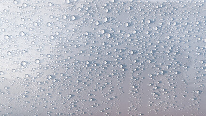 Drop water on white steel plate for abstract background.