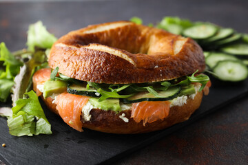 Concept of delicious food - tasty bagel sandwich