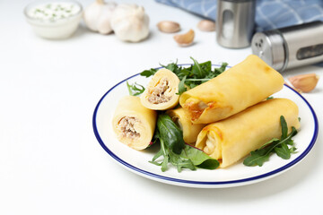 Concept of tasty food, thin pancakes with filling, space for text