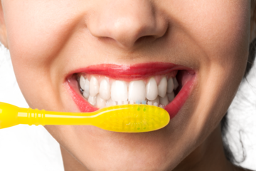 Closeup on a Woman Brushing her Teeth