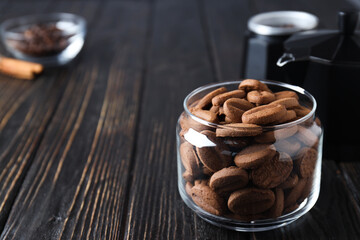 Concept of tasty snack for hot drink - cookies in the shape of coffee seeds