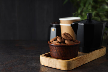 Concept of tasty snack for hot drink - cookies in the shape of coffee seeds