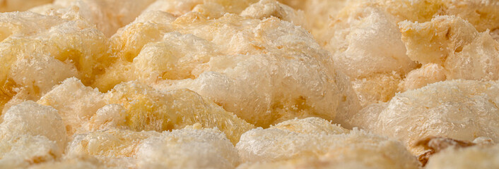 White Cheddar Puffed rice cake extreme macro view, isolated on white background