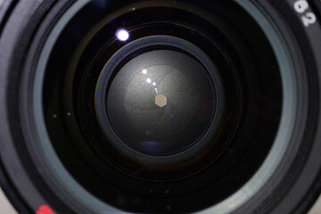 Camera lens with light and lens flare, close-up