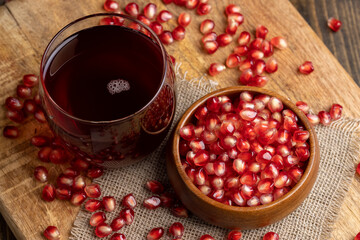 Sweet and sour pomegranate juice in a transparent glass