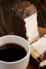 Fresh sweet cake with milk taste and aroma in chocolate glaze