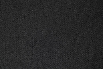Black cloth texture background. Close-up.
