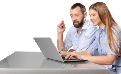 Business couple working on laptop sitting at desk