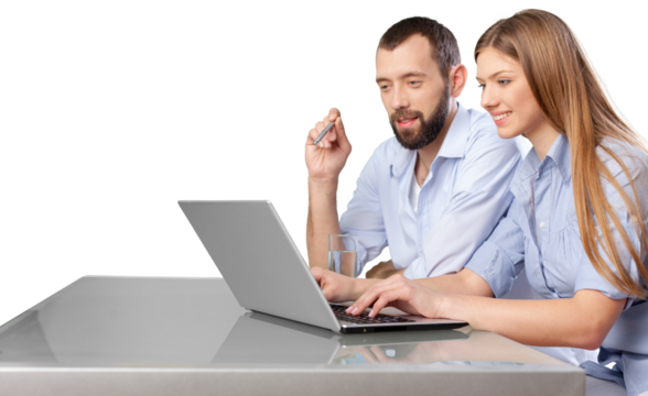 Business couple working on laptop sitting at desk