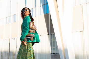 Urban woman enjoy outside. Modern woman posing with roller skates.