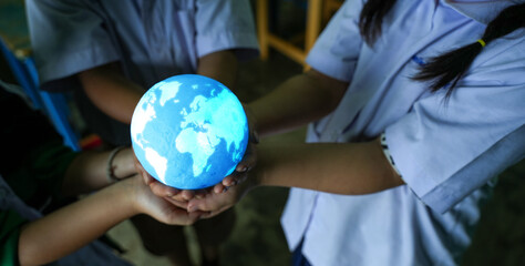 world environment day In hand holding green globe on green bokeh background. environmental protection And environmental sustainability. Save the earth. Earth day environment concept.
