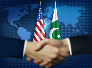 Two people shaking hands in front of American, and Pakistani flags.Pakistan, US bilateral relation concept background