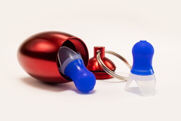 Silicone ear plugs for human ears on white background