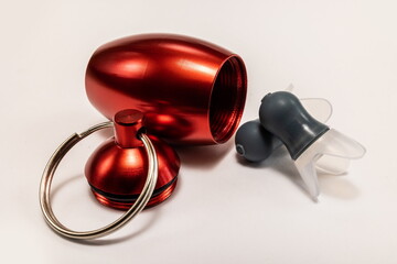 Silicone ear plugs for human ears on white background