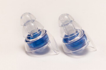 Silicone ear plugs for human ears on white background