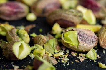 Crispy delicious pistachios with salt on the table