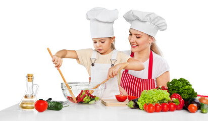 mother and daughter prepare salads