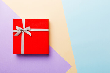 holiday handmade present tied gray ribbon bow top view with copy space. Flat lay holiday background. Birthday or christmas present. Christmas gift box concept with copy space